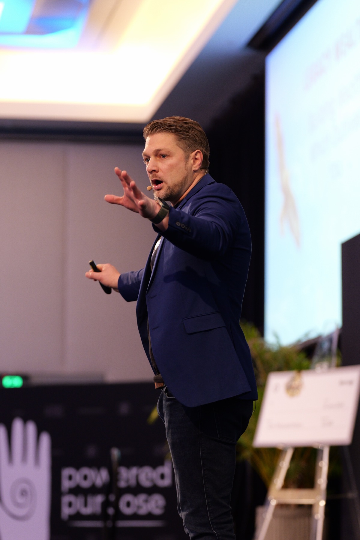 Todd Polke speaking on stage